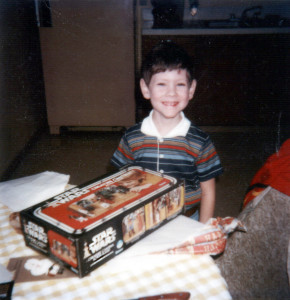 Little Jason opens a Star Wars play set for his birthday.