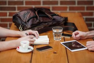 Two people at a professional networking coffee meeting